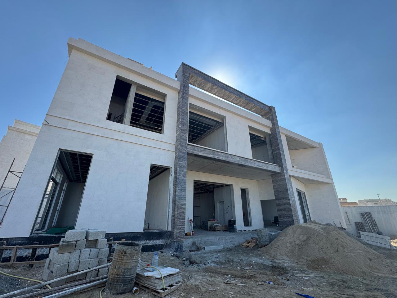 Villa exterior plastering and stone cladding finishing