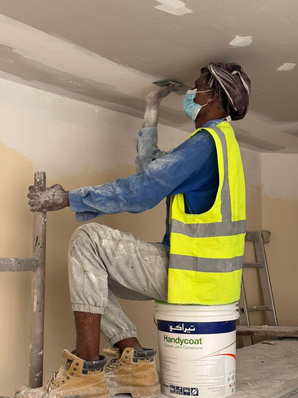Gypsum joint compound application on ceiling