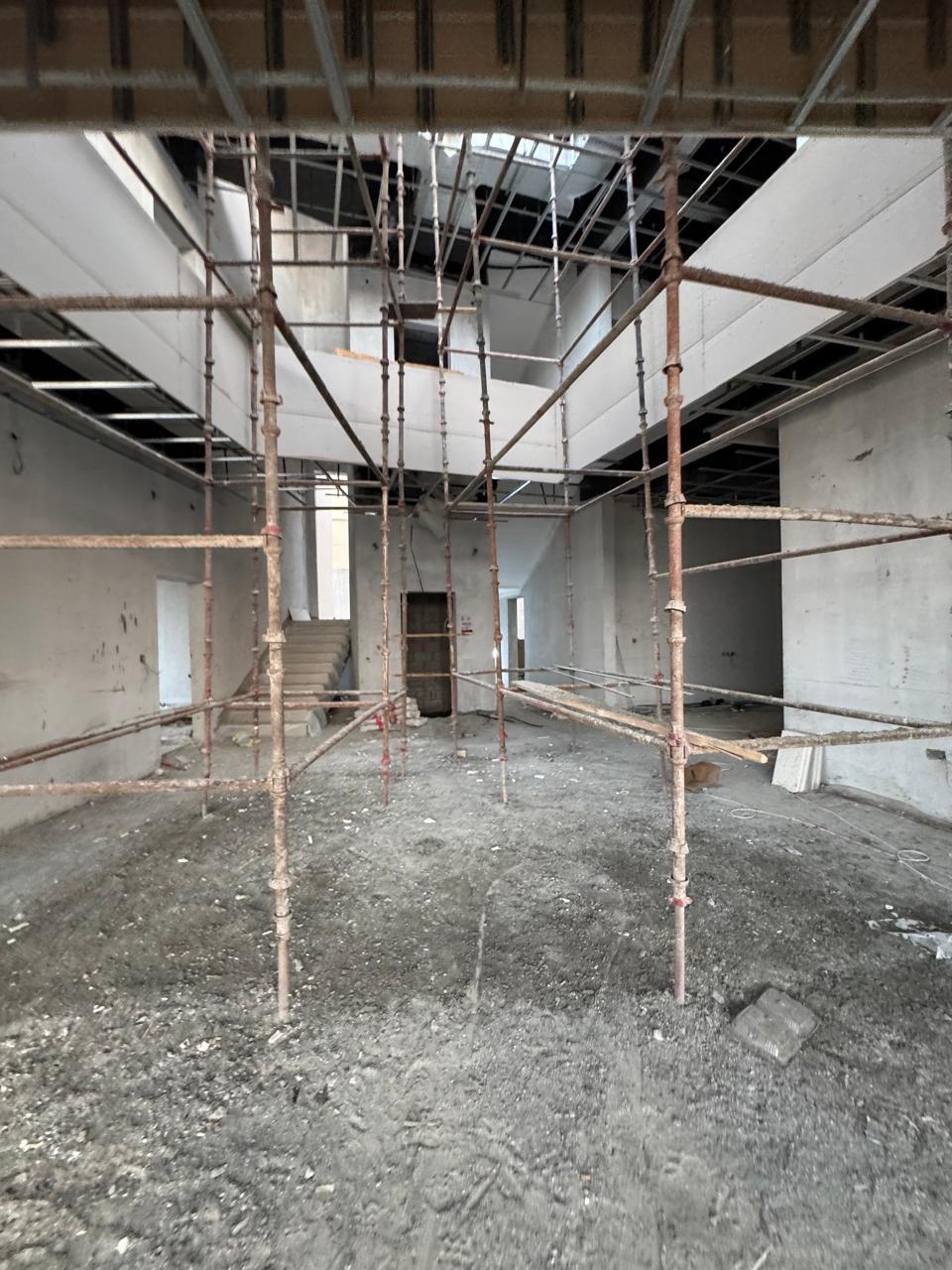 Scaffolding in double-height villa hall with false ceiling works