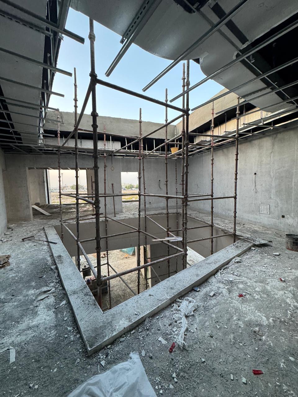 Scaffolding around void slab opening in villa construction
