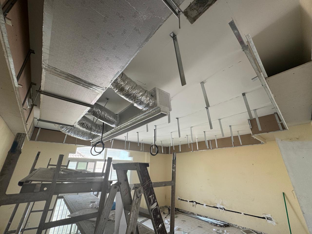 HVAC ductwork and ceiling framing with scaffold