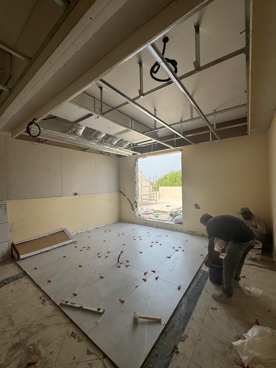 Villa floor tiling with ceiling grid framework
