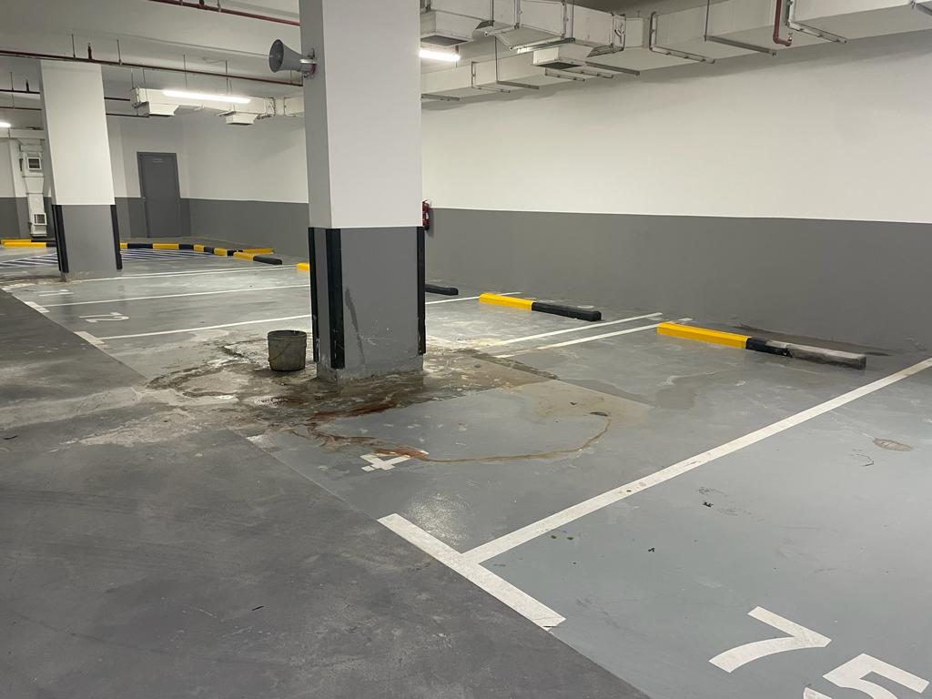 Parking basement after concrete repair and floor coating