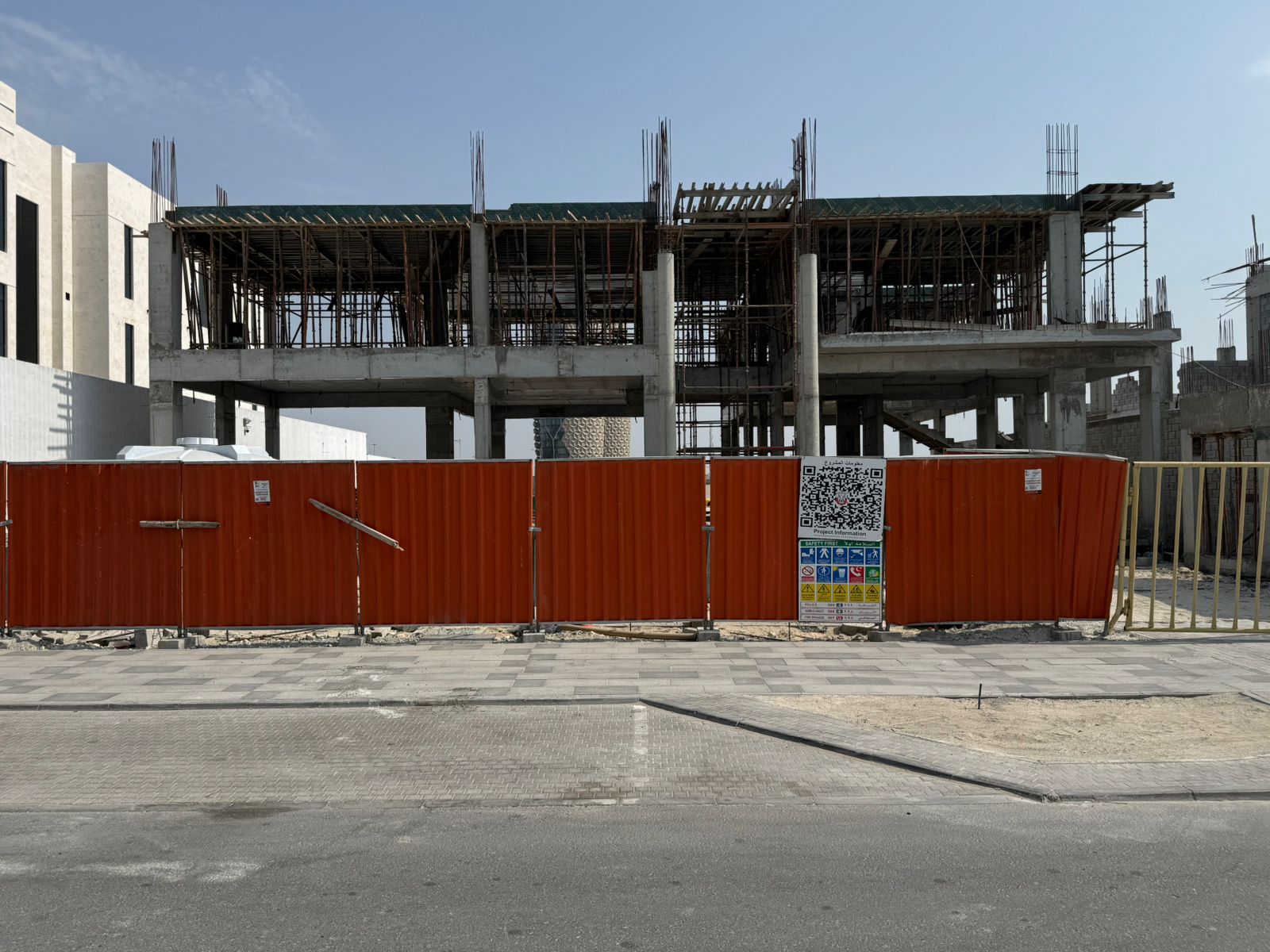 Villa construction site hoarding with safety signage