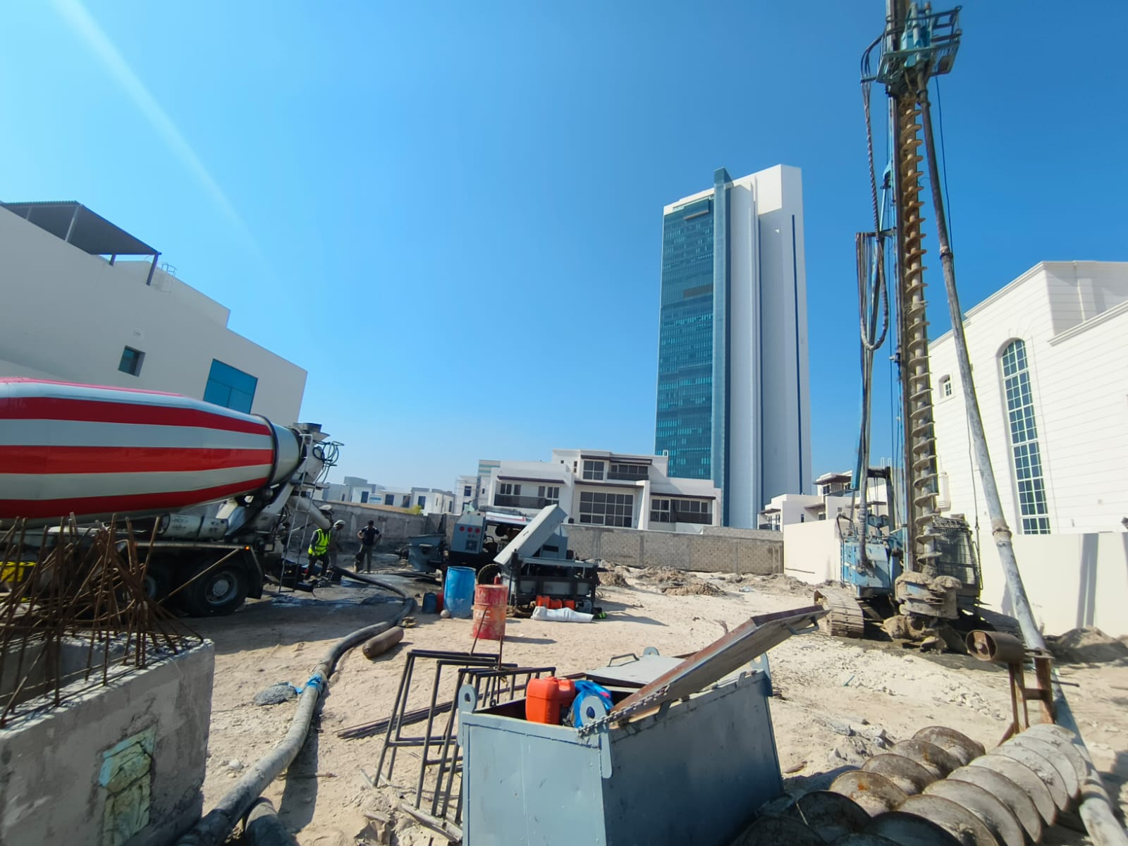 Piling rig with concrete mixer on residential project