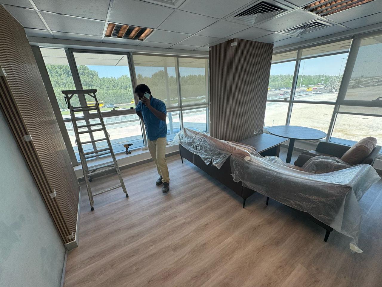 Office lounge with wood cladding and roller blinds