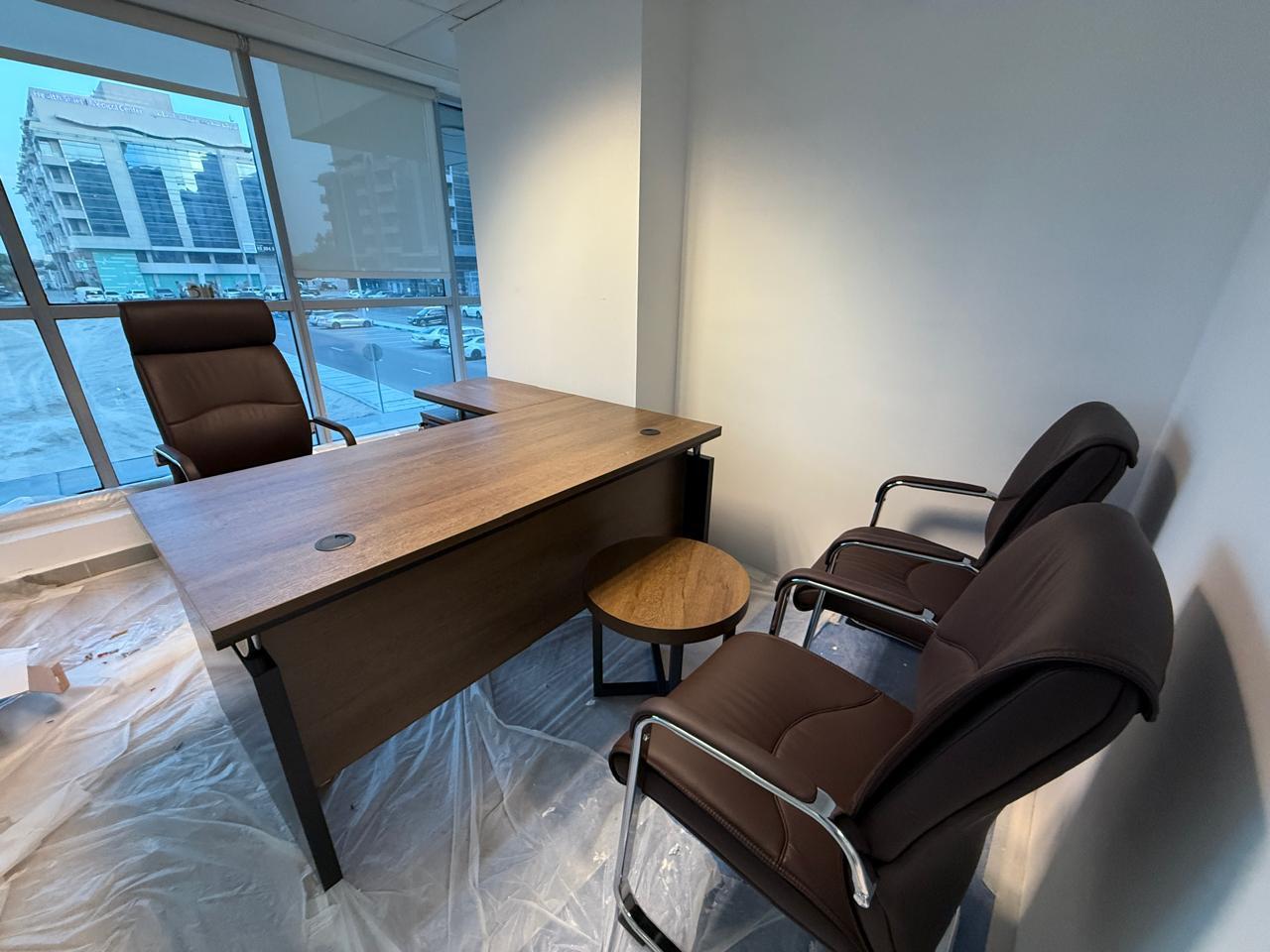 Executive desk and chair setup in private office