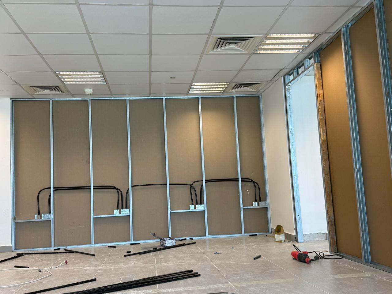 Office partition framing with ceiling tile grid