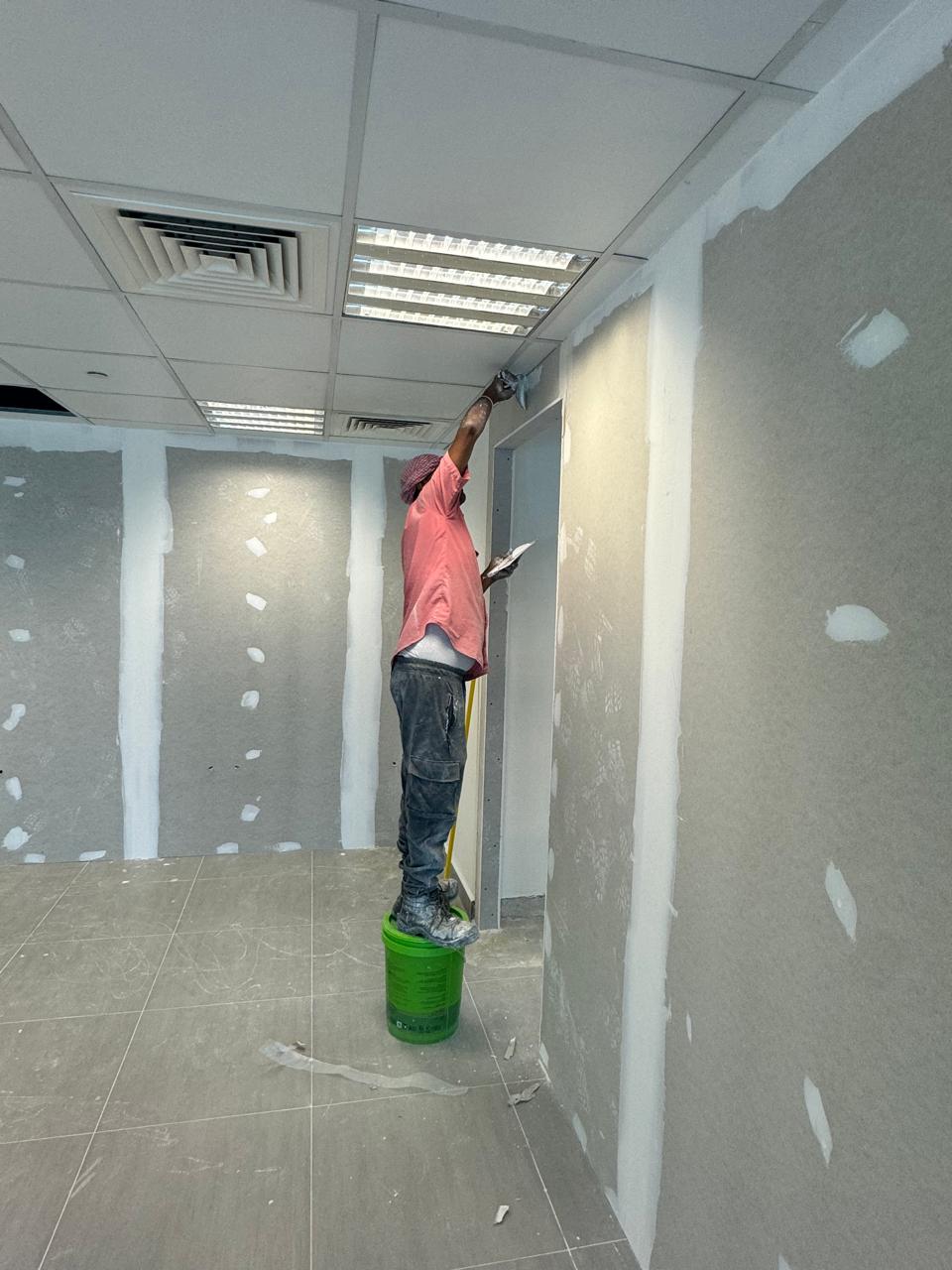Drywall joint compound application in office fit-out