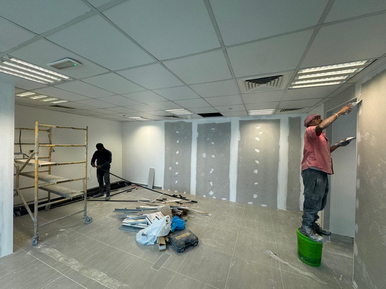 Office wall plastering and drywall finishing team