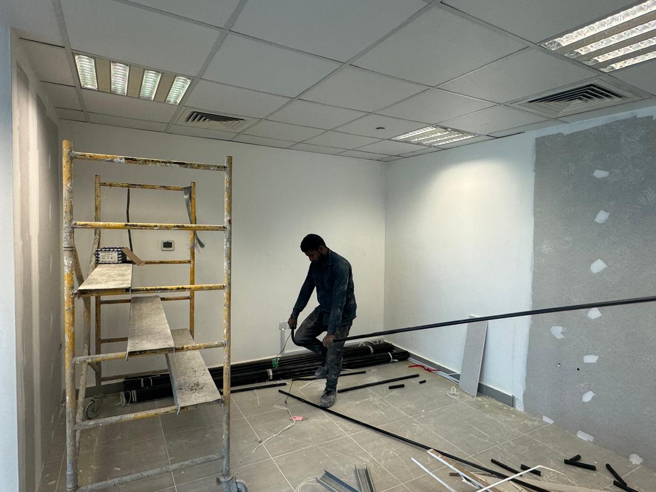 Ceiling grid and metal framing installation in office