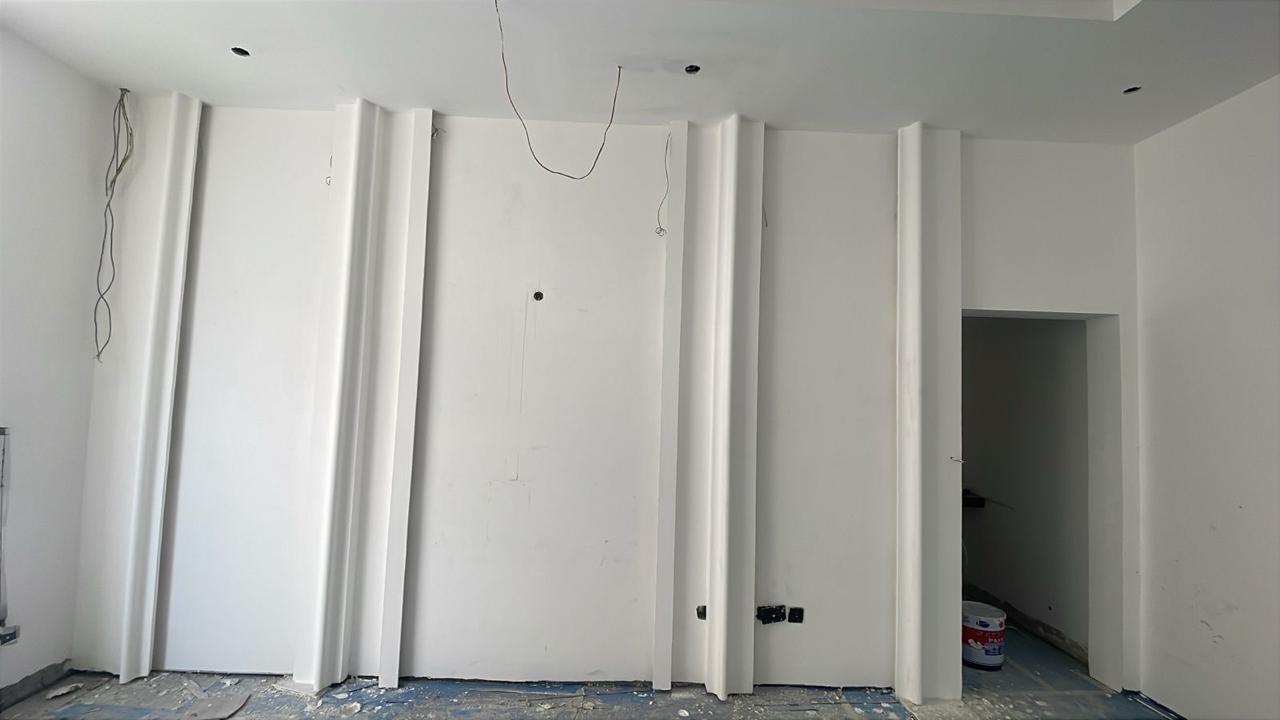 Gypsum fluted wall paneling in villa interior