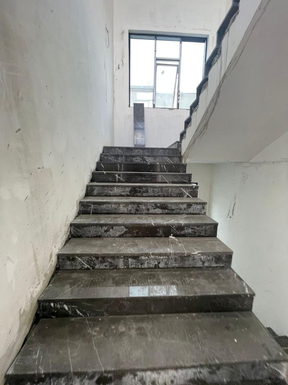 Marble staircase installation in villa