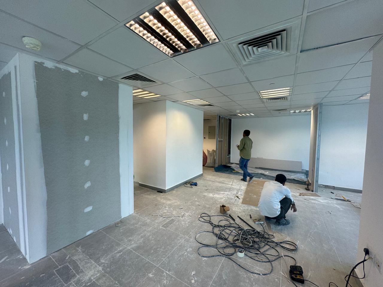 Office drywall partition and ceiling tile installation