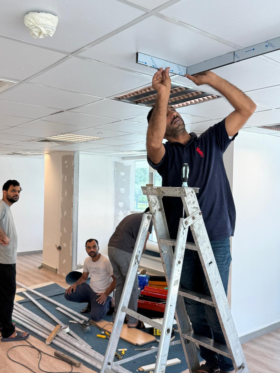 Ceiling tile and light fixture installation