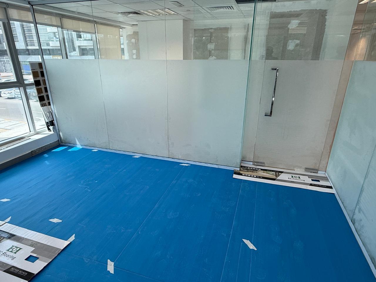 Completed frosted glass partition with floor protection