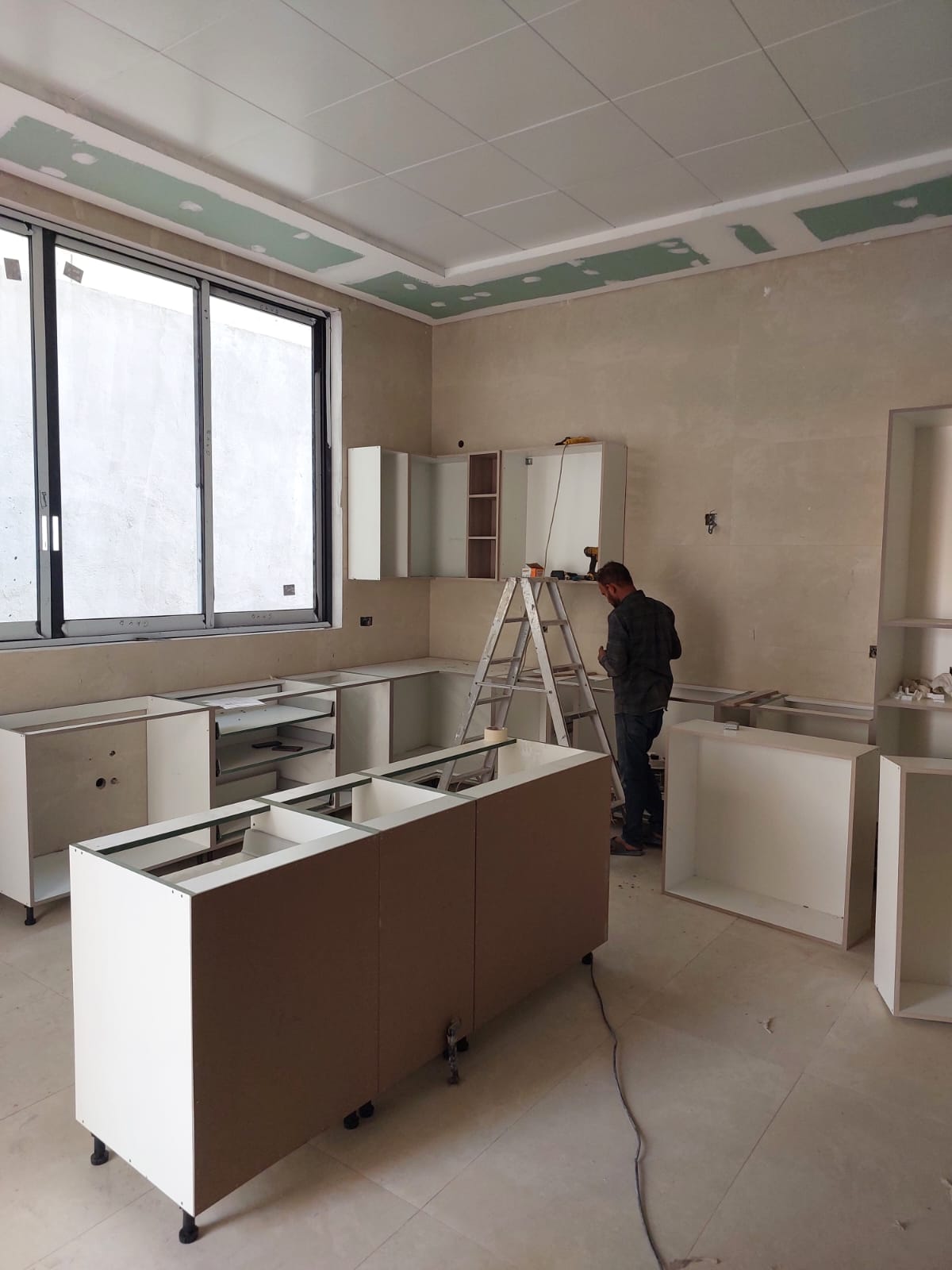 Kitchen cabinet and upper unit installation in villa