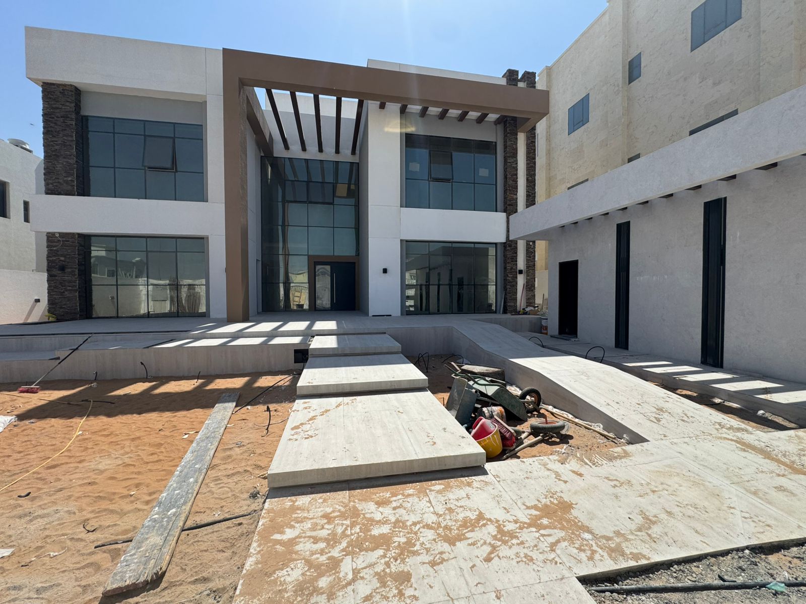 Villa entrance with pergola and external paving Abu Dhabi