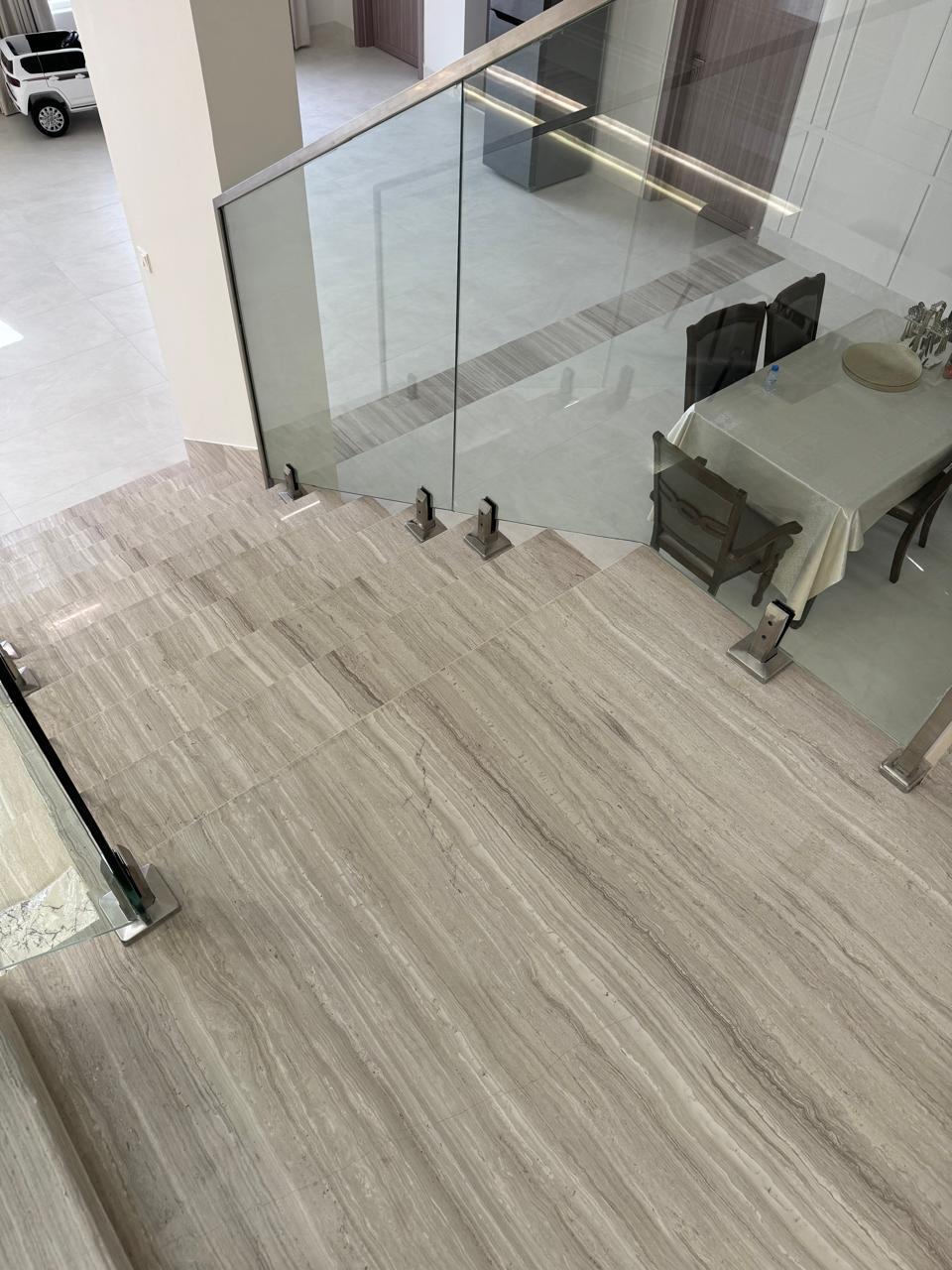 Marble staircase with glass balustrade top-down view