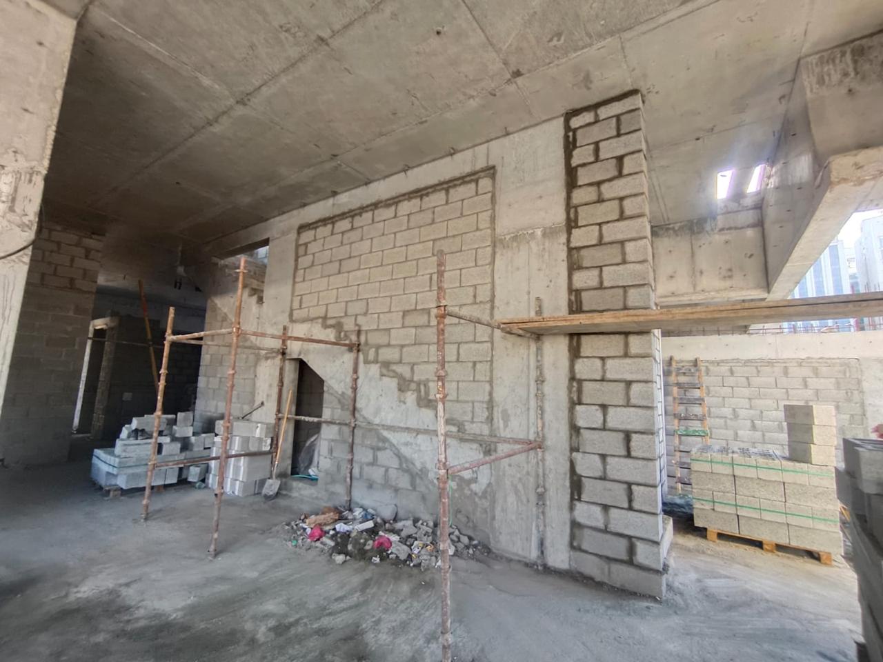 Blockwork walls with scaffolding in commercial building