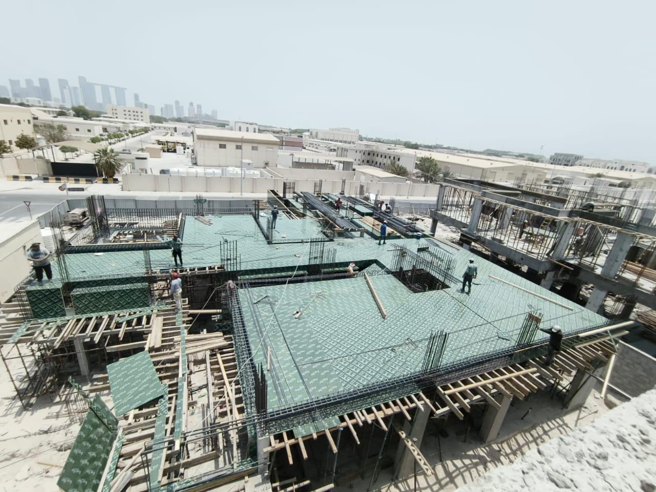 Aerial view of slab formwork with green plywood sheeting