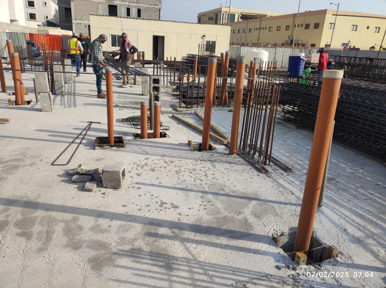 Foundation drainage risers and rebar reinforcement