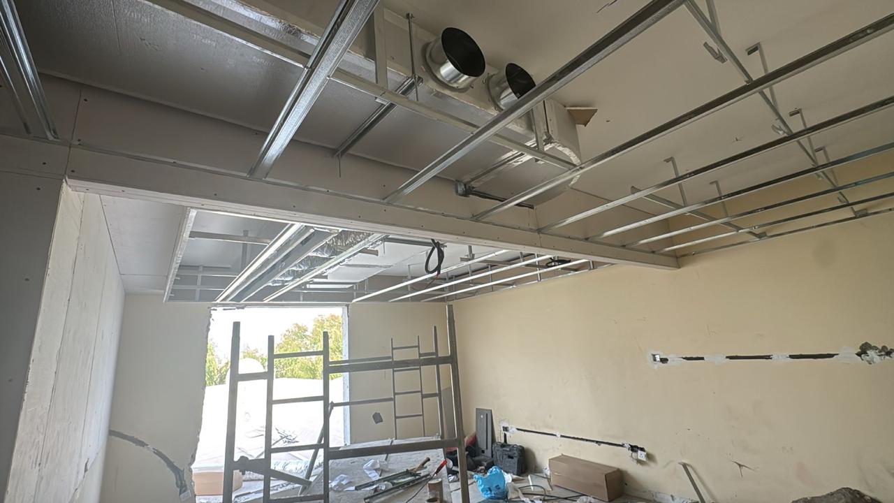 Ceiling grid framework with AC diffuser openings