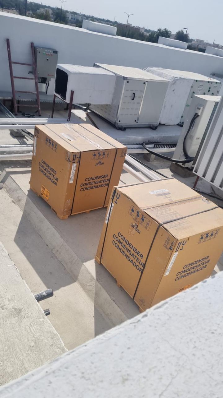 AC condenser units on rooftop – HVAC contractor Abu Dhabi