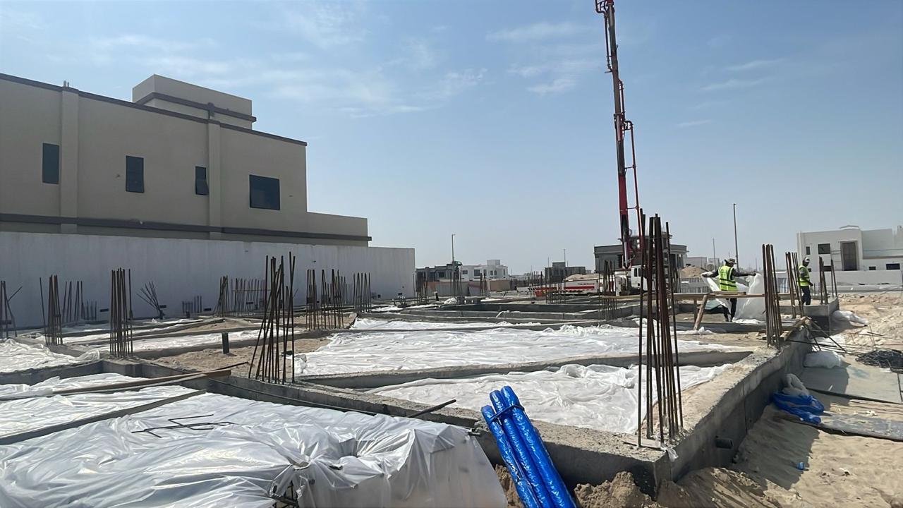 Foundation curing with protective sheeting on site