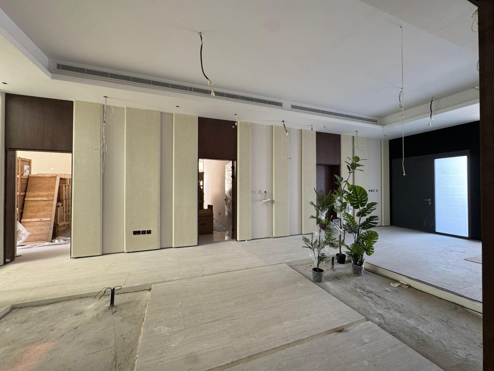 Villa lobby with fluted wall panels and wood cladding