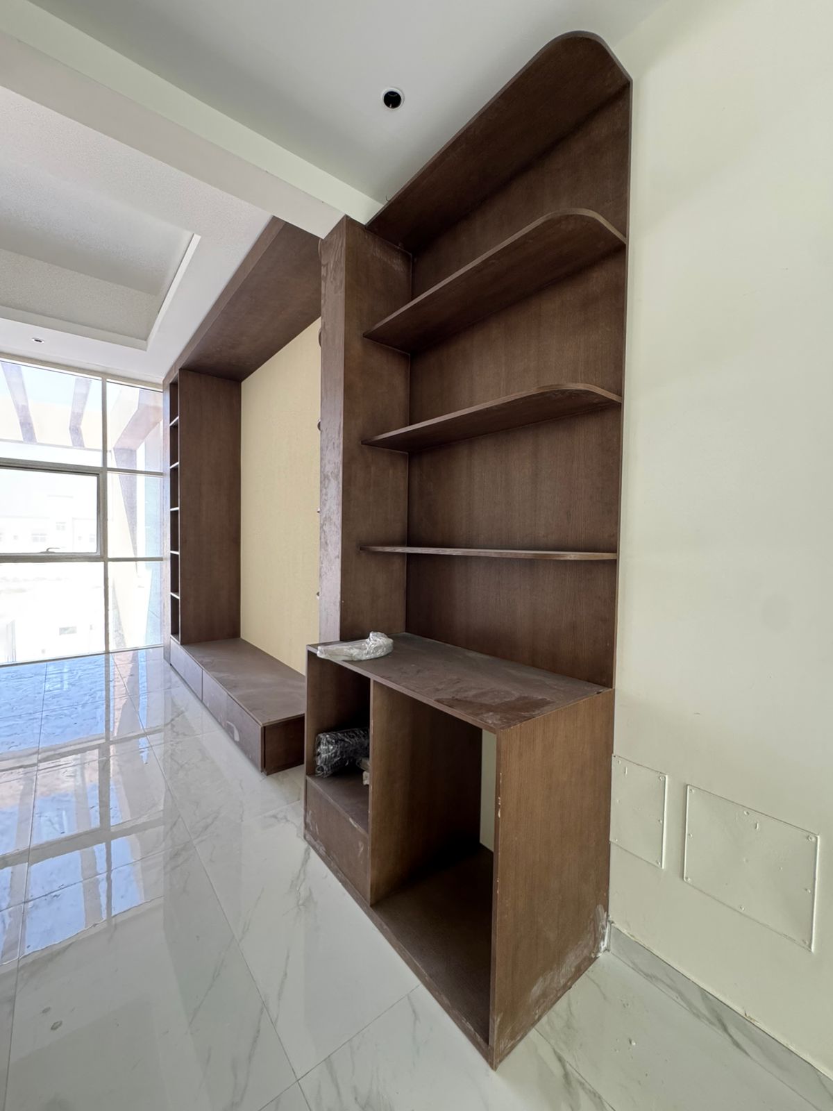 Custom TV unit and shelving joinery in villa