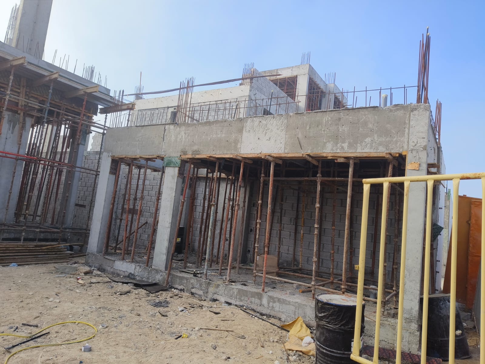 Workers tying rebar on site