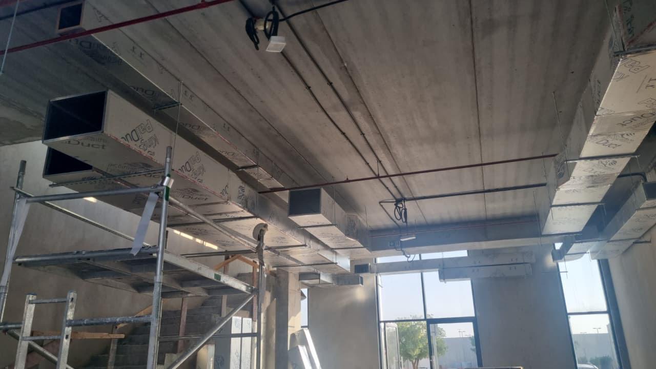 Commercial HVAC duct routing with fire suppression piping