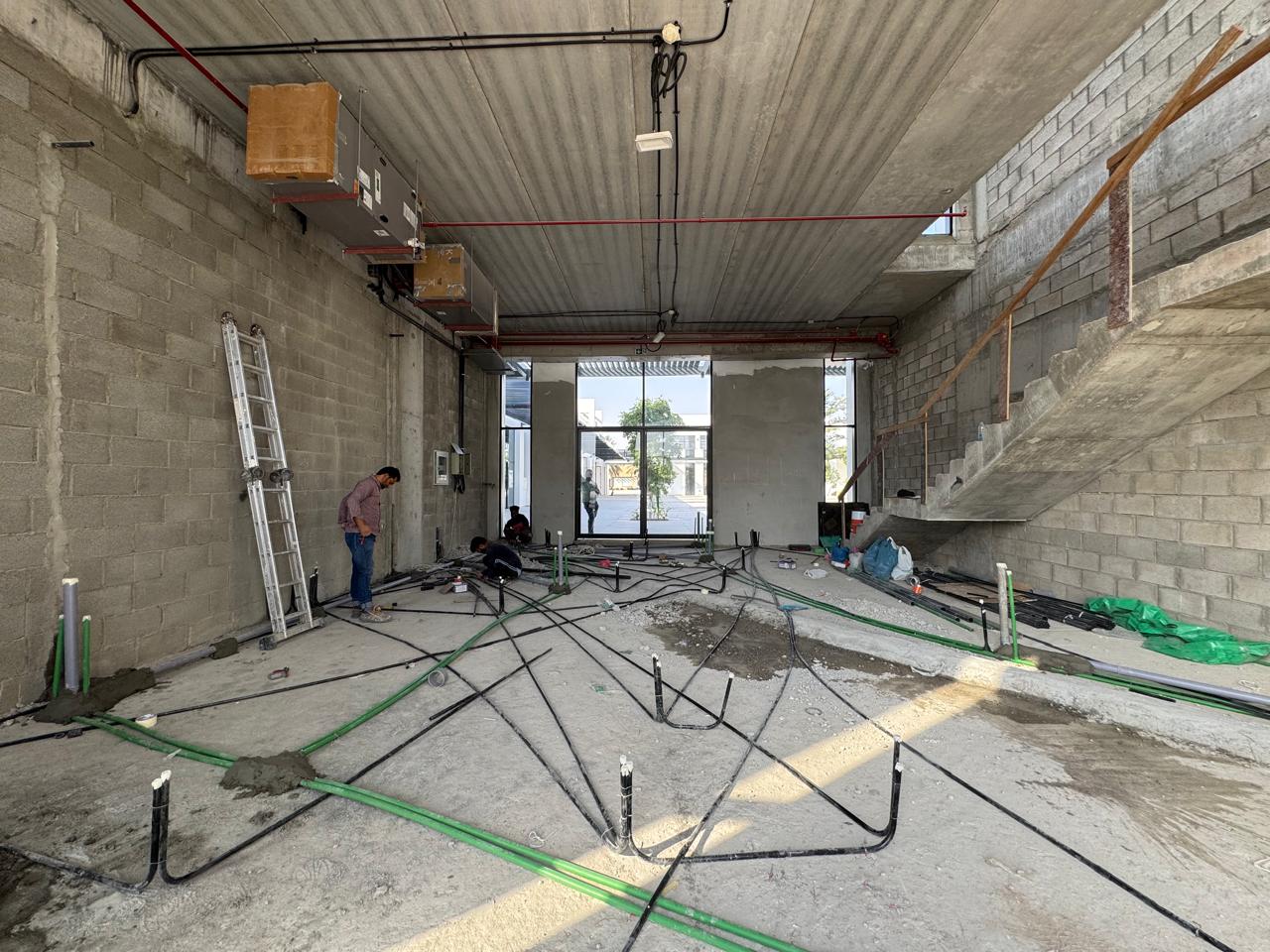 MEP floor piping installation team in villa