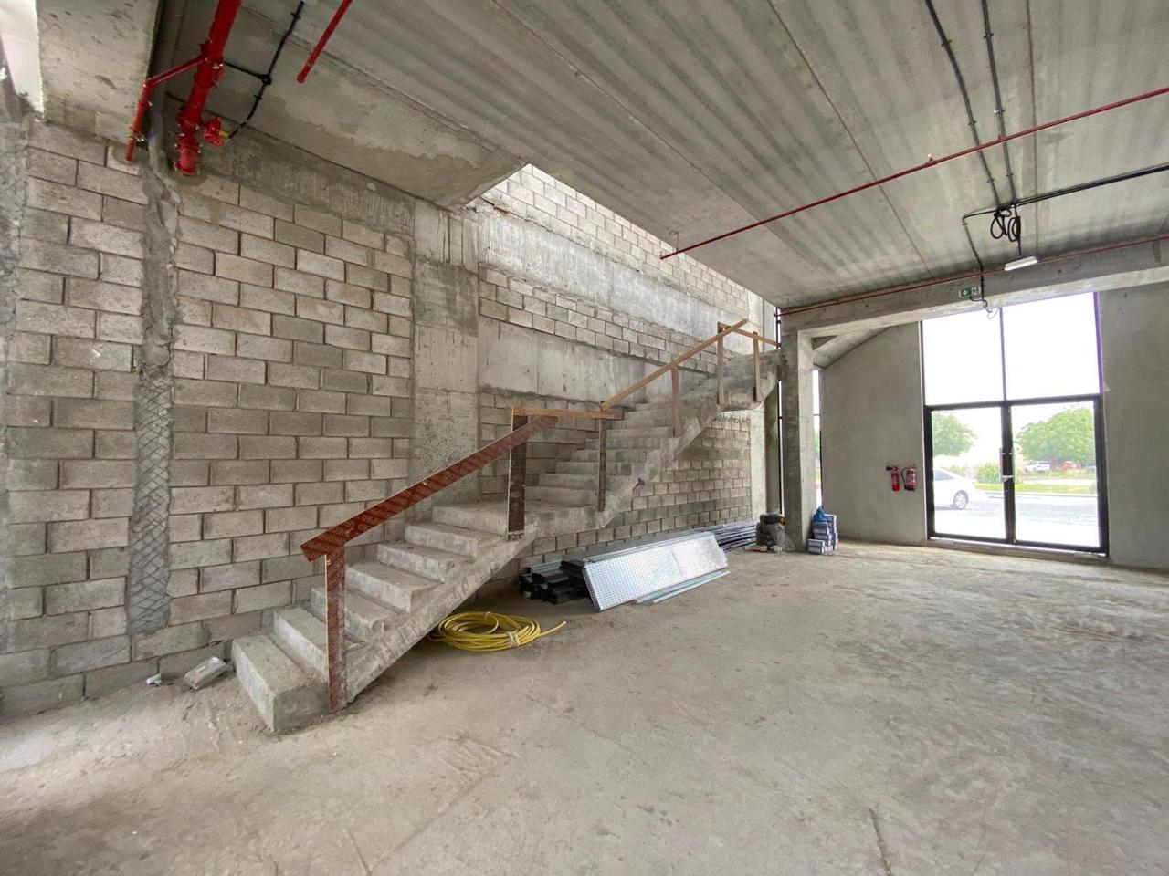 Staircase wide view with fire piping and glazed entrance