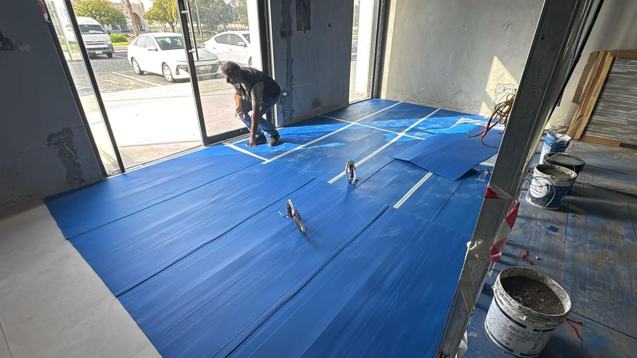 Floor protection sheeting installation in retail fit-out
